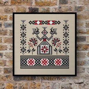 May include: Cross stitch pattern featuring a stylised house with birds, flowers, and geometric designs in black, red, and white on a beige background. The pattern is framed and includes the text "LMA patterns".