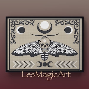 May include: Black and white cross stitch pattern featuring a moth with a skull head, crescent moons, and the text "LesMagicArt".