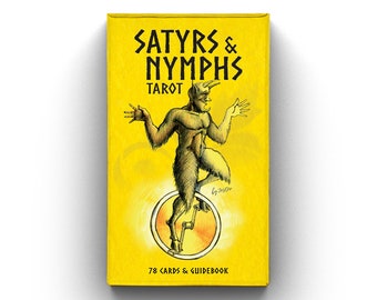 May include: A yellow box with the text "SATYRS & NYMPHS TAROT" and an illustration of a satyr on a unicycle. The box also says "78 CARDS & GUIDEBOOK".