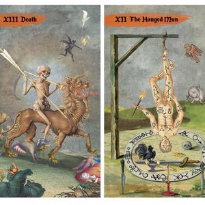 May include: Two tarot cards with illustrations. The first card, "XIII Death," depicts a skeletal figure riding a lion-like creature. The second card, "XII The Hanged Man," shows a person hanging upside down. Both cards have text in the upper corners.