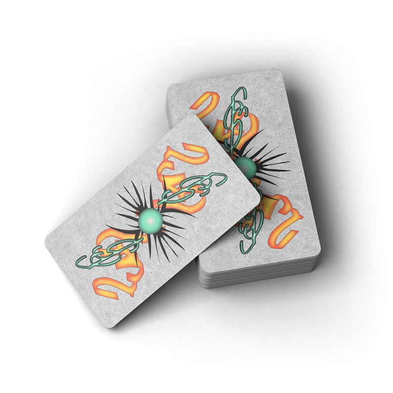 May include: Two playing cards with a gray background and a black, green, and orange design. The design features a stylized swirl with a green orb in the center.
