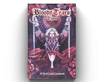 May include: A box of Bloody Tears Tarot cards with a dark, gothic design. The box features a man holding two swords, a chalice, and a red background with floral accents. The text on the box reads "Bloody Tears Tarot" and "78 Tarot Cards & Guidebook".
