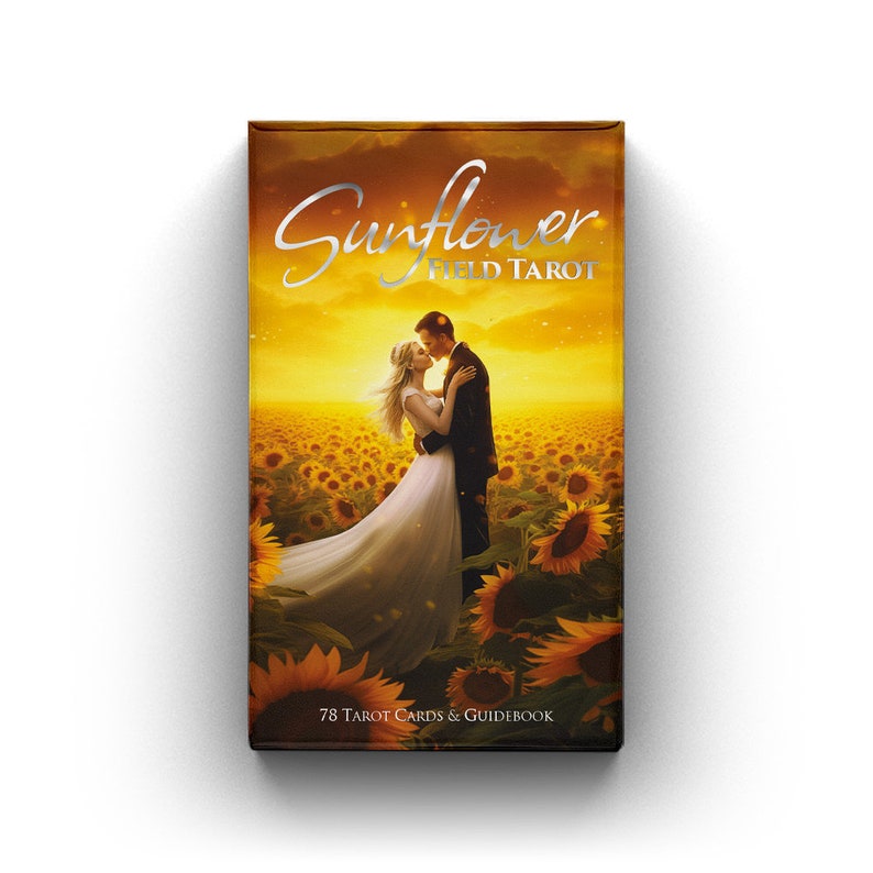 May include: A tarot card deck box with the title "Sunflower Field Tarot" in silver script. The box features an image of a couple embracing in a field of sunflowers under a golden sky. The bottom of the box reads "78 Tarot Cards & Guidebook."