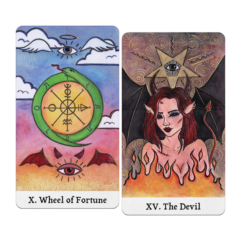 May include: Two tarot cards: "X. Wheel of Fortune" and "XV. The Devil." The Wheel of Fortune card features a green snake around a wheel, an eye, and a red bat-like symbol. The Devil card depicts a woman with horns, wings, and a tail, surrounded by flames.