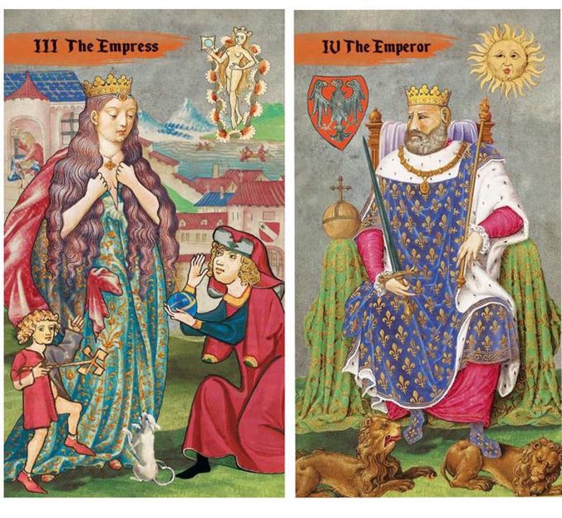 May include: Two tarot cards featuring illustrations. The first card, "III The Empress," depicts a woman in a crown and flowing gown, with figures and a town in the background. The second card, "IV The Emperor," shows a crowned man seated, holding a scepter, with lions at his feet.
