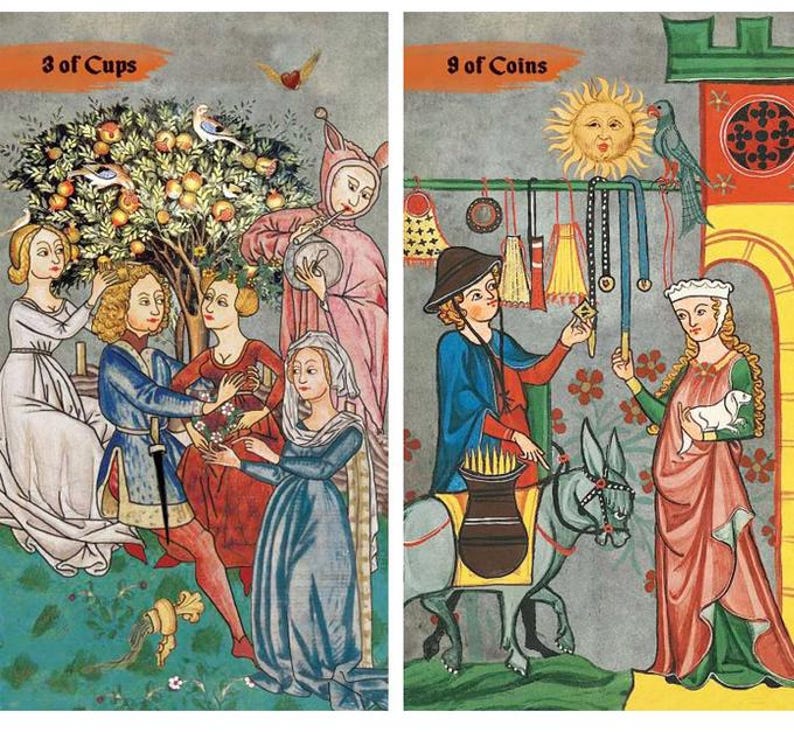May include: Two tarot card illustrations. The left card, "3 of Cups," depicts figures near a fruit tree. The right card, "9 of Coins," shows a person with a donkey and another holding a lamb. Both cards have medieval-style art.