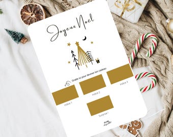 May include: A white Christmas scratch card with gold detailing and the text "Joyeux Noël". The card features a Christmas tree design and three scratch-off areas labelled "Indice" and "Surprise". Festive holiday theme.