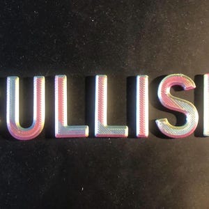 May include: The word "BULLISH" spelled out in iridescent pink and blue letters.
