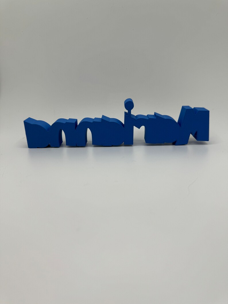 May include: A blue plastic word spelled "mom" in a stylized font.
