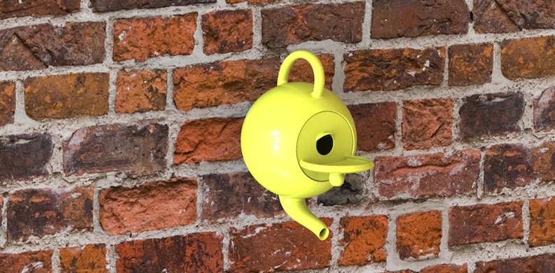 May include: A bright yellow birdhouse with a round body, a small spout, and a handle. The birdhouse is mounted on a weathered brick wall. The birdhouse has a small perch and a circular opening for the birds.