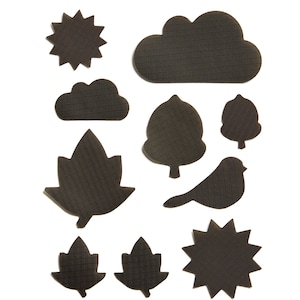 May include: A set of ten black felt cutouts of various shapes, including a sun, clouds, leaves, and a bird. The cutouts are all textured with a grid pattern.