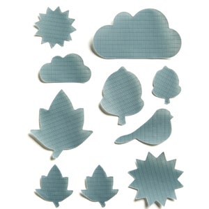 May include: A set of ten blue paper cutouts in the shapes of a sun, clouds, trees, leaves, and a bird. The cutouts are all on a white background.
