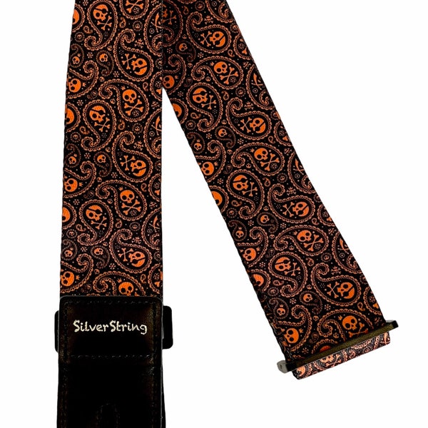 Silverstring Custom 2” Orange Paisley Skulls Guitar Strap. The perfect strap for any guitar. Easy adjustment, fits all sizes.