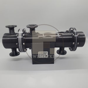 May include: A black metal heat exchanger with multiple pipes and a label that reads "IGLESIA WORTHINGTON MANN.COM.  MODEL: JOF-EXTECHONAL  SERIAL NO: 1234567890".