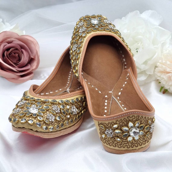 Traditional indian wedding ceremony : Groom puts on wedding shoes Stock  Photo | Adobe Stock