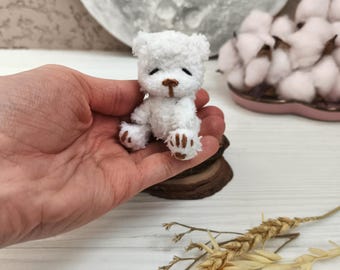 Miniature plushy teddy bear stuffed. Tiny animal for collection