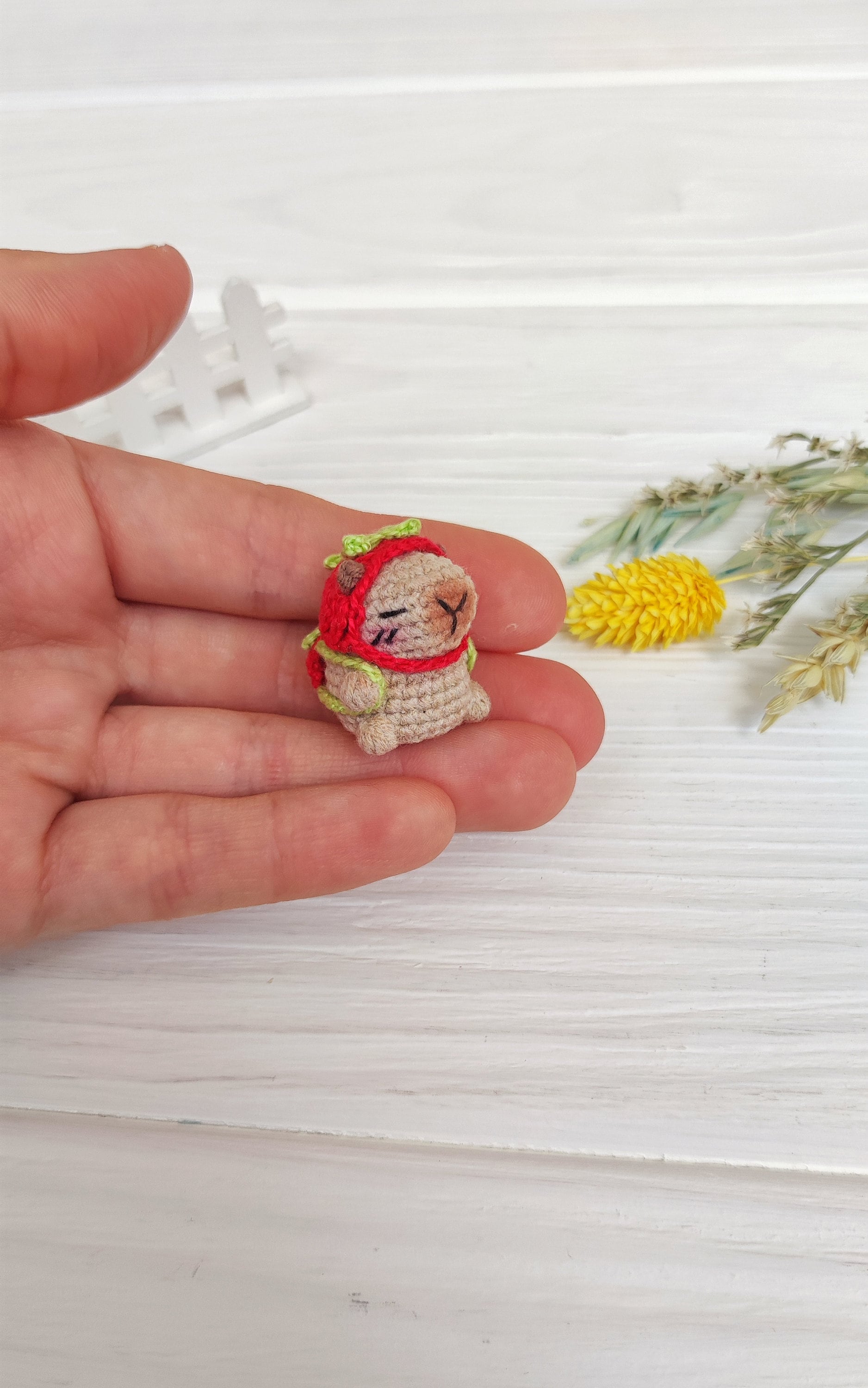 Micro stuffed capybara in strawberry hat. Cute miniature 1 inch capy toy. Lovely tiny crochet animal. Gift for mom, girl, back to school