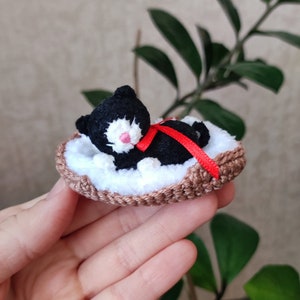Small kitten plushie toy. Tiny stuffed black cat figurine. Miniature sleeping cat. Little lovely animal. Cute pocket pet friend for doll