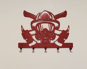 May include: Red metal firefighter helmet and axe key holder with five hooks.