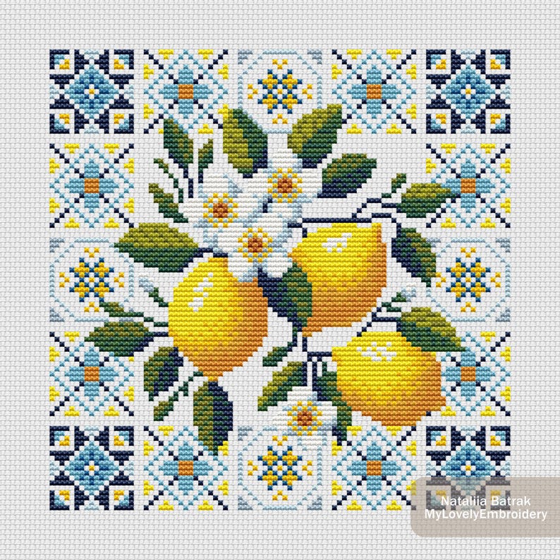 May include: Cross-stitch pattern featuring a lemon branch with three yellow lemons, white blossoms, and green leaves. The design is set against a background of blue, yellow, and white geometric tile patterns, creating a vibrant, decorative piece.