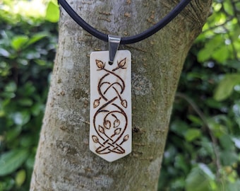Antler pendant with intertwined vine decoration