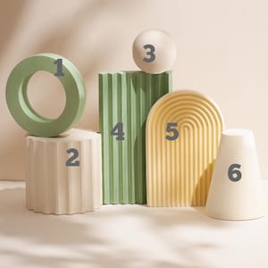 May include: A set of six decorative geometric shapes in various colors, including green, white, and yellow. The shapes are numbered 1 through 6.