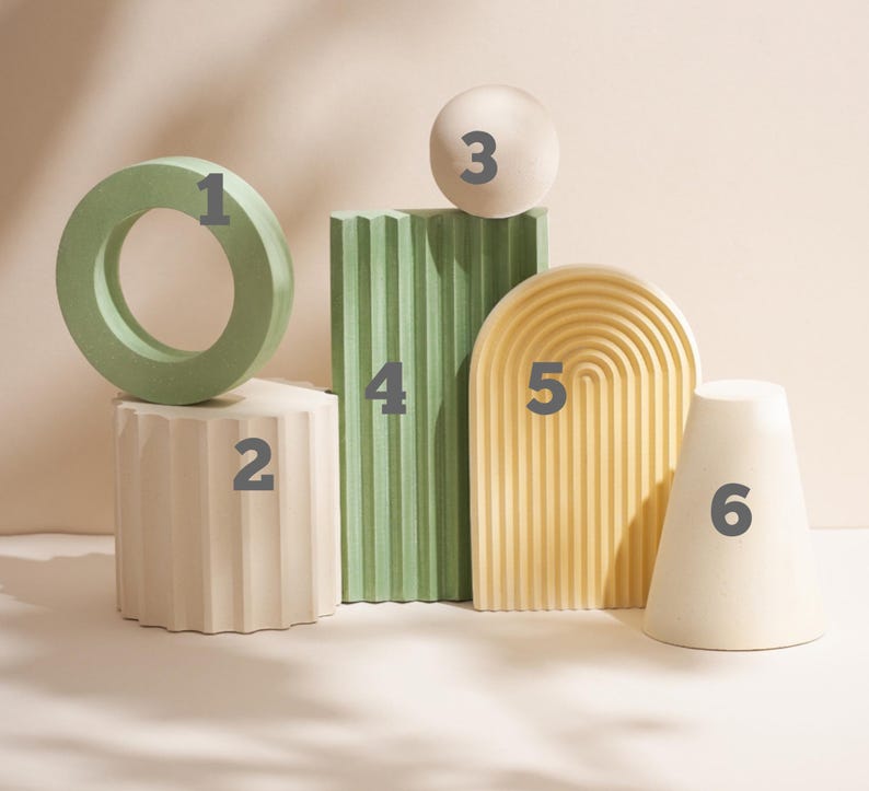 May include: A set of six decorative geometric shapes in various colors, including green, white, and yellow. The shapes are numbered 1 through 6.
