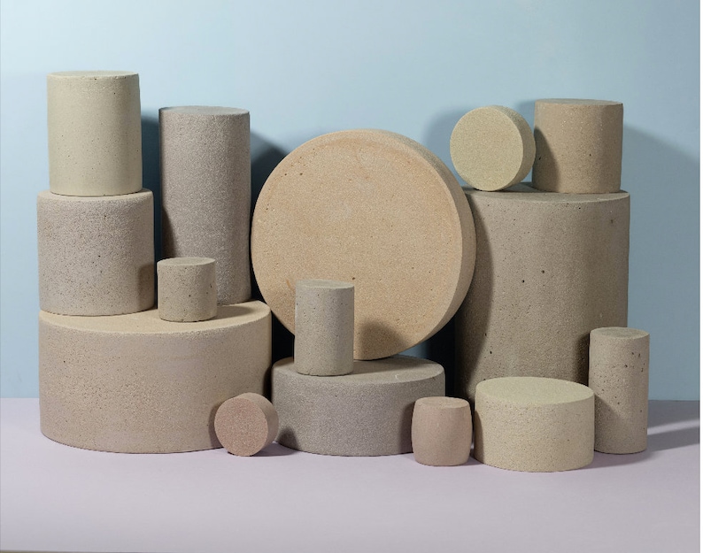 unique textured props made of concrete. The multicolor geometric design of these props adds a touch of style and sophistication to your studio shots. these props are perfect for adding depth and interest to your product photos.