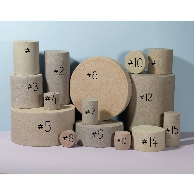 May include: A collection of 15 round and cylindrical beige foam blocks of various sizes, numbered 1 through 15.