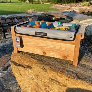 Cedar Wood ice chest with Removable insulated liner inside, Sitting on a rock plain front with no personalization