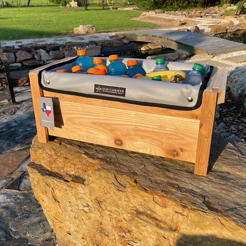 Cedar Wood ice chest with Removable insulated liner inside, Sitting on a rock plain front with no personalization