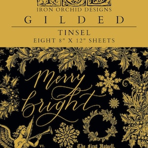 May include: A gold foil sheet with a black background featuring a Christmas-themed design. The design includes a holly wreath, snowflakes, and the words "Merry Bright". The sheet is part of the Iron Orchid Designs Gilded Tinsel collection and includes eight 8-inch by 12-inch sheets.