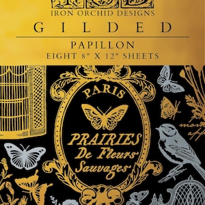 May include: Black and gold decorative paper sheets with butterfly and floral designs. The text reads "GILDED PAPILLON EIGHT 8" X 12" SHEETS" and "IRON ORCHID DESIGNS". The design includes a bird, butterflies, and the words "PARIS PRAIRIES De Fleurs Sauvages".