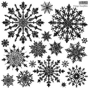 May include: A collection of black, intricate snowflake illustrations on a white background, featuring various ornate, vintage-style patterns. The text "IOD" and "Vintage Snowflakes" is printed in the top right corner of the image.