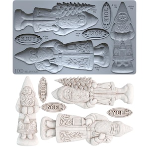 May include: A gray silicone mold sheet featuring recessed designs of two bearded figures in long coats, one holding a tree, and three oval plaques with the text JOIE, NOEL, and YULE. The sheet includes volume and weight markings for each shape.