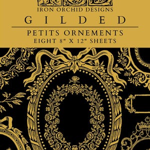 May include: A set of eight 8" x 12" sheets of Iron Orchid Designs Gilded Petits Ornements. The product features gold-colored decorative motifs, including floral wreaths, ribbons, and ornate frames, printed on a solid black background.