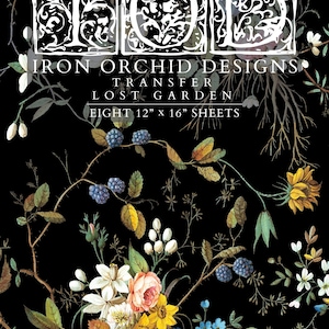 May include: A black transfer sheet set titled IOD Iron Orchid Designs Lost Garden featuring eight 12 inch by 16 inch sheets. The design displays botanical illustrations of blackberries, yellow sunflowers, white and pink flowers, and green foliage.