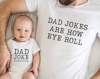 May include: A white t-shirt with the text "Dad Jokes Are How Eye Roll" and a white onesie with the text "Dad Joke Survivor".