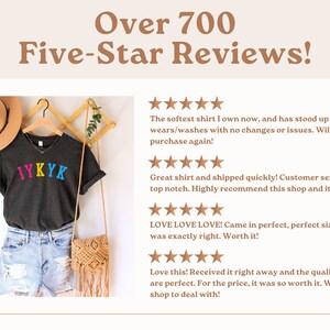 May include: A dark gray t-shirt with the text "IYKYK" in rainbow colors. The shirt is on a hanger and has a brown hat and a woven bag next to it. The image includes customer reviews with five-star ratings and positive comments about the shirt.