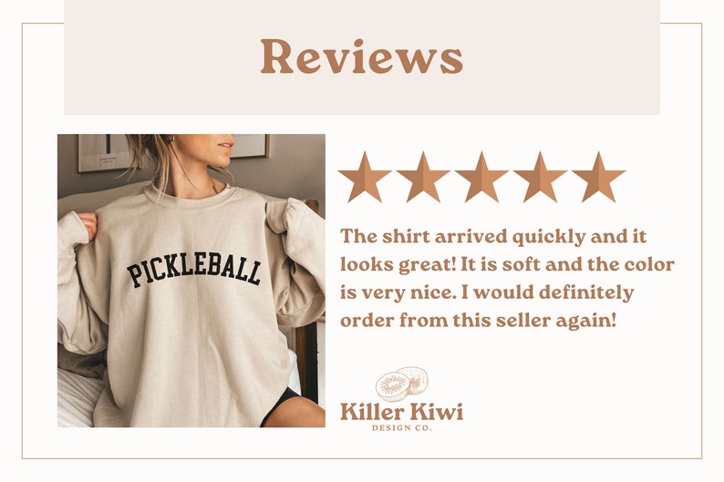 May include: A beige sweatshirt with the word "PICKLEBALL" printed in black on the front. The sweatshirt is being worn by a person. The image includes a five-star rating and a review that says "The shirt arrived quickly and it looks great! It is soft and the color is very nice. I would definitely order from this seller again!" The review is from Killer Kiwi Design Co.