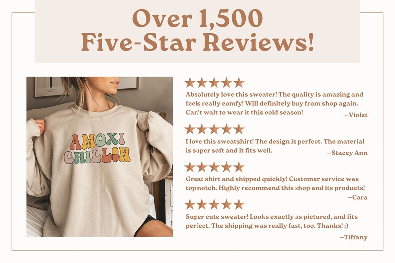 May include: A beige sweatshirt with the text "AMOXI CHILLON" in colorful retro font. The sweatshirt has a crew neck and long sleeves. The model is wearing the sweatshirt and smiling.