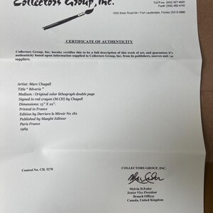 May include: A certificate of authenticity from Collectors Group, Inc. for a Marc Chagall lithograph titled "R&ecirc;verie." The document includes details such as dimensions of 15" x 22", the artist's signature, and the print's origin in France.