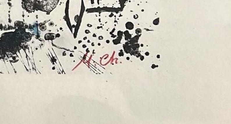 May include: Abstract artwork with black ink splatters and brushstrokes on a white background. A red signature is visible in the lower right corner. The artwork has a modern, expressive style.