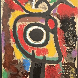 May include: Abstract painting with bold black lines and shapes on a beige background. The painting features a large, circular shape with a black center and a white ring, surrounded by red, yellow, green, and blue paint.