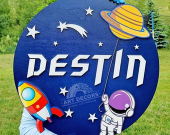 Customizable Space/Science theme kids room 3D name sign round plaque, with rocket, stars, astronaut and planet.  Cute Sign for Nursery decor