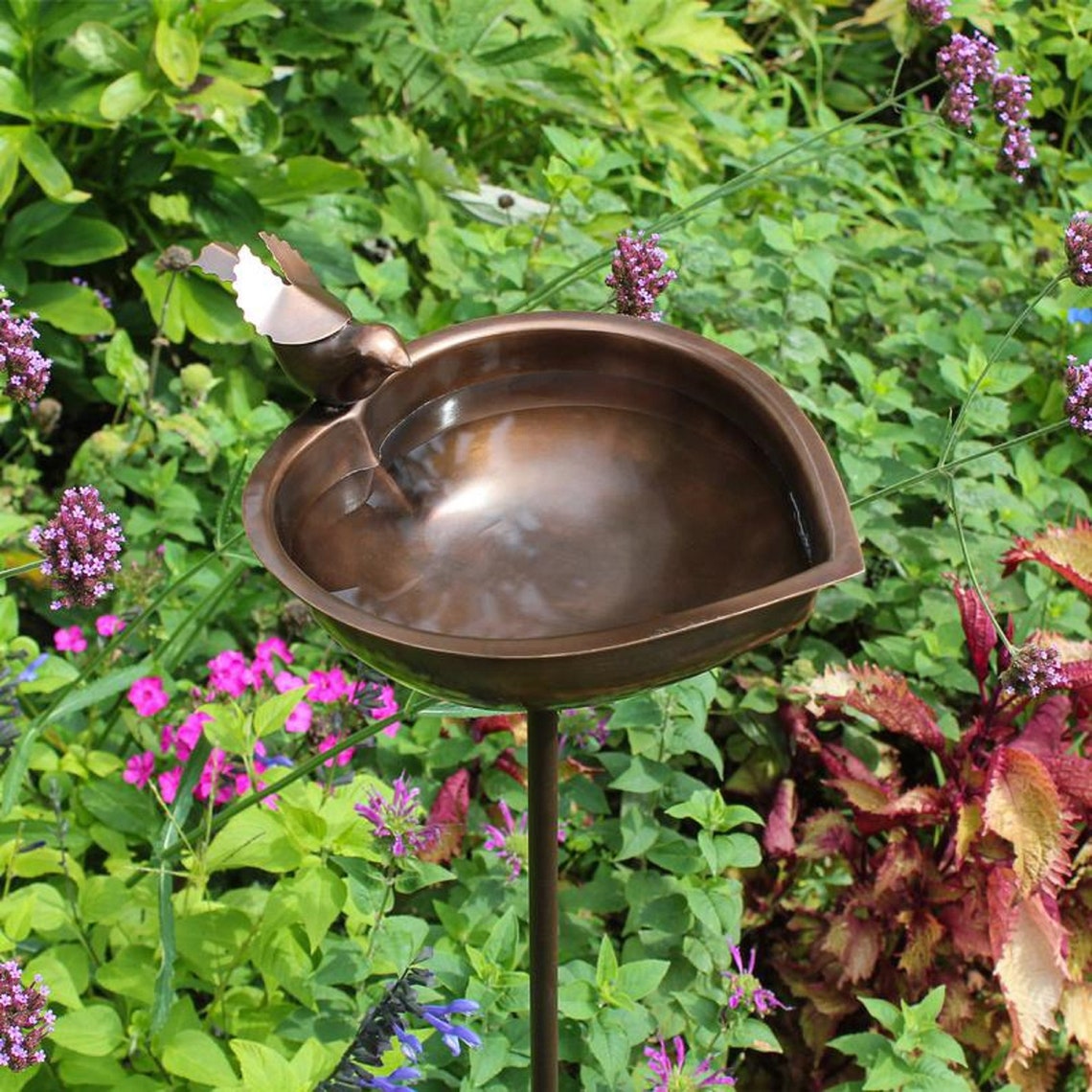 The bird's bath is made of bronze Etsy