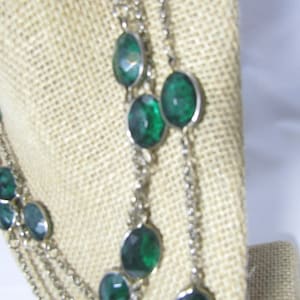 bezel set long chain necklace with green crystals