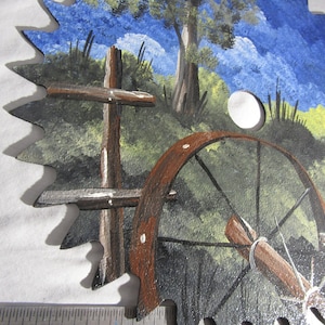 hand painted old wagon wheel bright moon light on saw blade