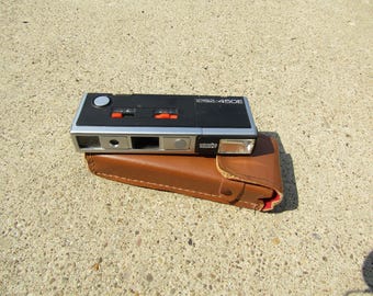 Minolta Autopak 450E vintage y estuche