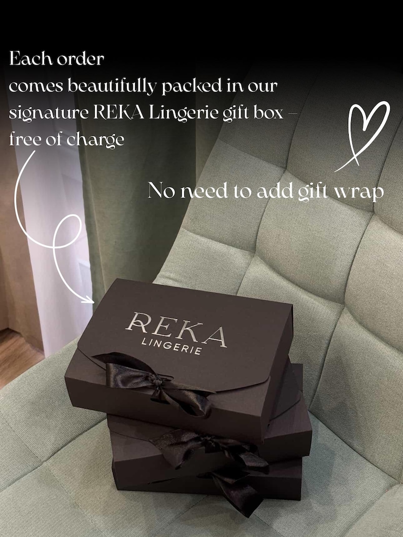 May include: Three dark brown gift boxes with black satin bows are stacked on a light green chair. The top box has the text "REKA LINGERIE" in silver. Text in the image states "Each order comes beautifully packed in our signature REKA Lingerie gift box free of charge. No need to add gift wrap."